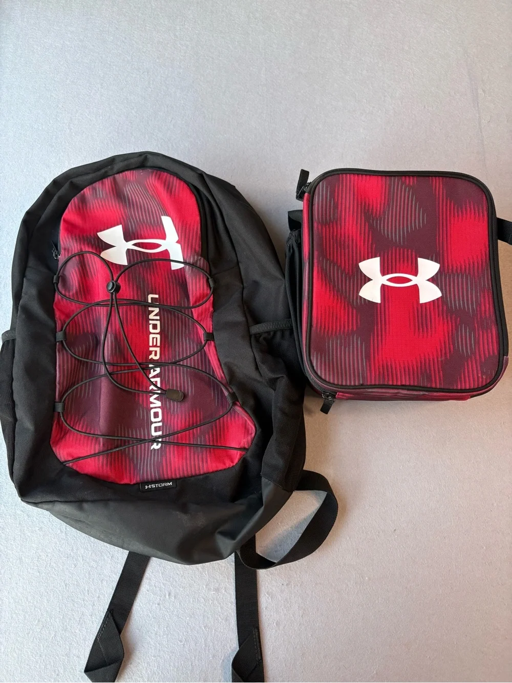 Under Armour Hustle Sport Red/Black Backpack Bungee Front & Matching Lunchbox